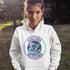 Featuring a stunning graphic of a majestic snowy owl in flight, set against the glowing northern lights, this hoodie embodies the freedom and grace of the province’s untamed wilderness.